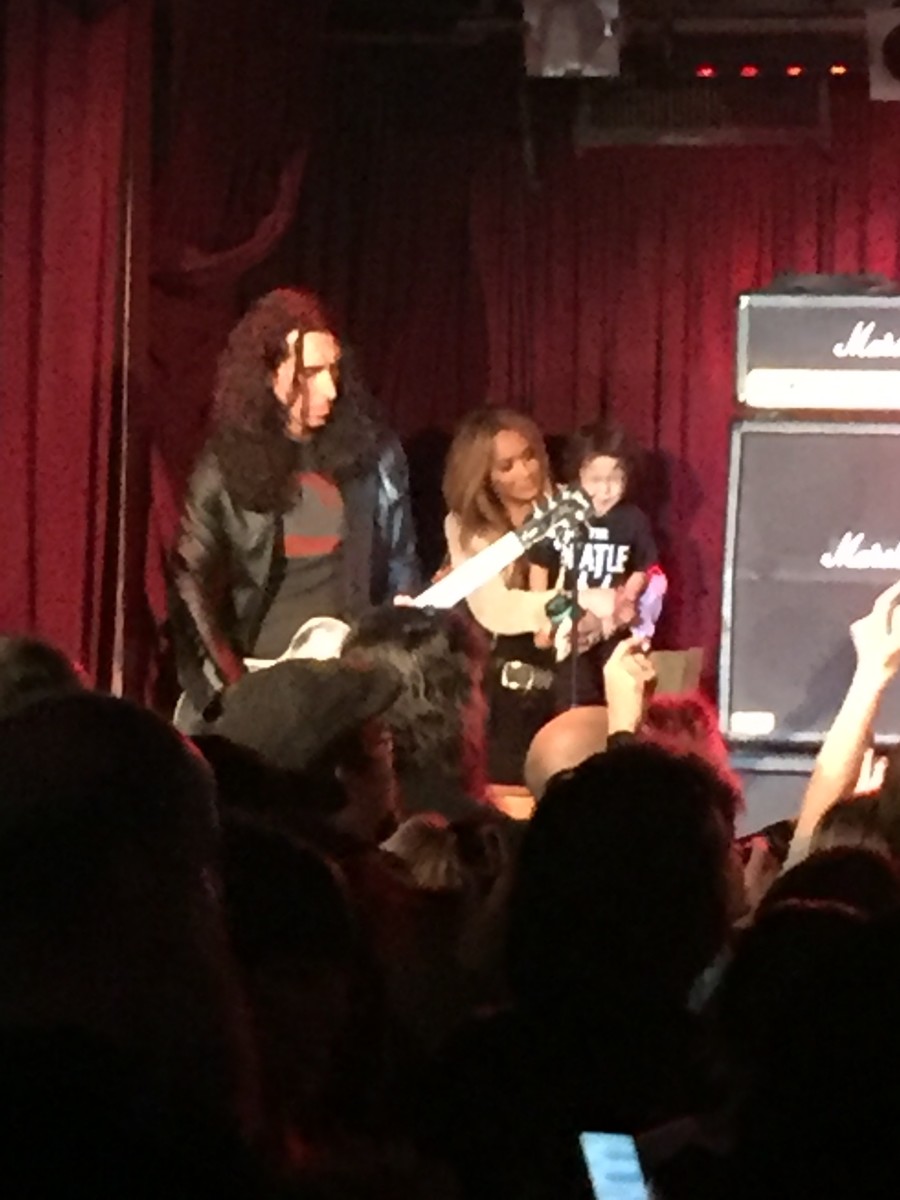 Brent Woods Lead Guitar Sebastian Bach Band May 18, 2016 at B.B. King's House of Blues, with Sebastian's wife and son in the background